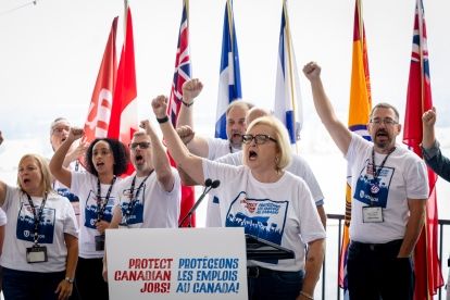 Lana Payne at a outside podium fist raised
