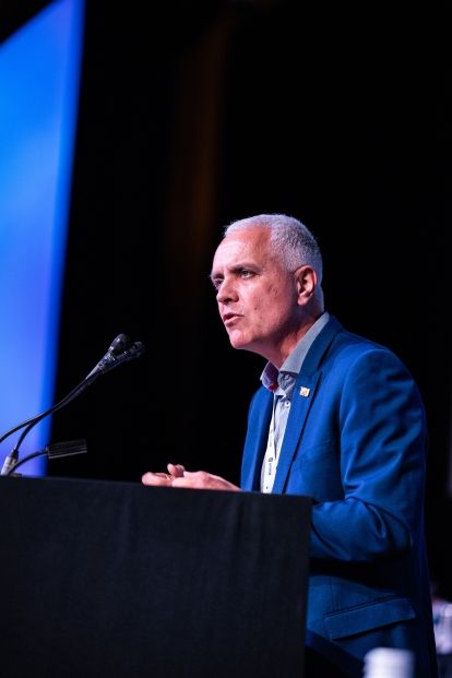 A man speaking at a podium