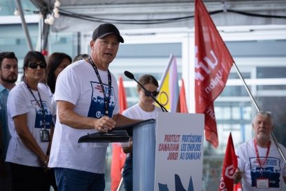 A man speaking at a podium