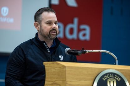 A man speaking at a podium