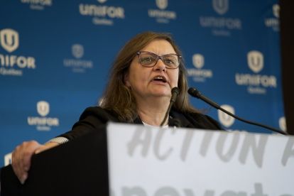a women speaking at a podium