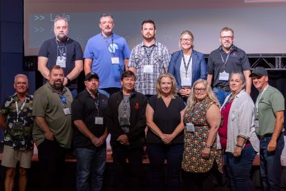 Industry council representatives pose in two rows