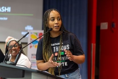 A women speaking at a mic