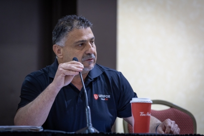 Man with microphone in front of him