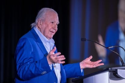 man with hands raised