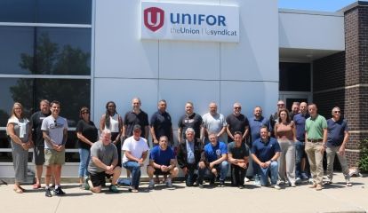 A large group outside a Unifor building