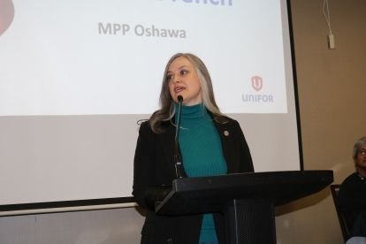 A women speaking at a podium