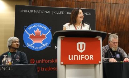 A women speaks at a podium