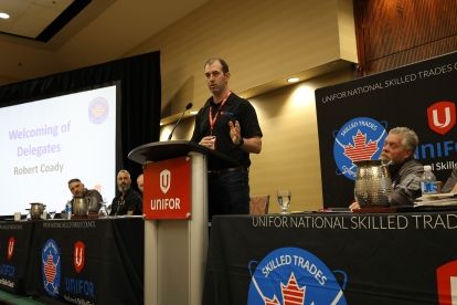 A man speaking at a podium