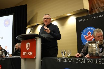 man speaking at podium