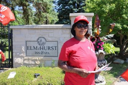 woman standing outside Elm Hurst Inn &amp; Spa