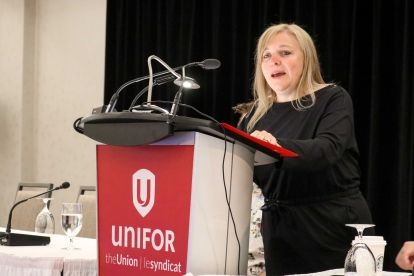 A woman speaking at podium