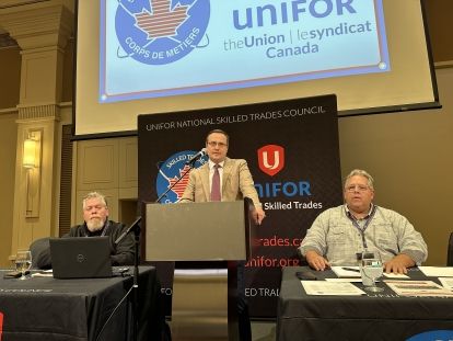 A man speaks at a podium