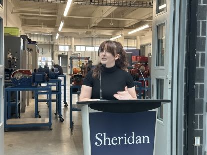 Woman standing at podium
