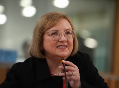 Lana Payne speaking into a mic