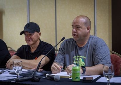 two men sitting at a table