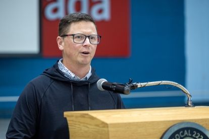 A man speaking at a podium