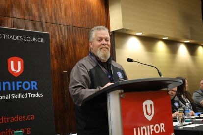 man speaking at podium