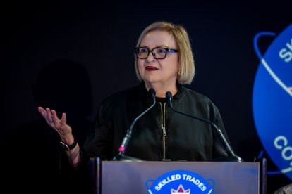 a women speaking at a podium