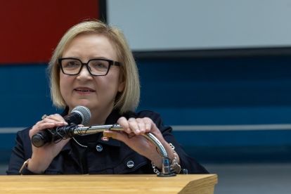 A women speaking at a podium