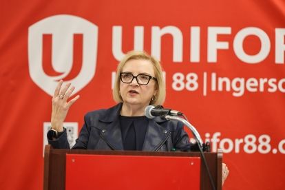 A women speaking at a mic