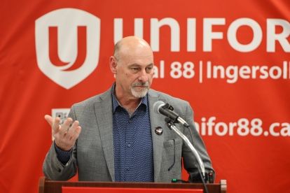 A man speaking at a podium