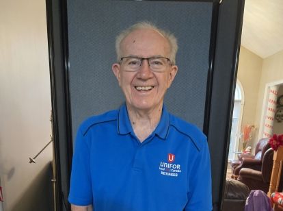 A man wearing a blue shirt.