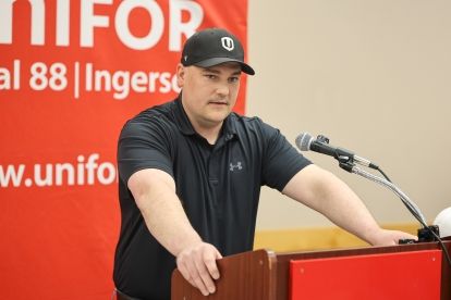 A man speaking at a podium