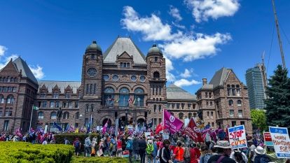 A huge crowd rallies in front of Queen's Park during the OHC health care rally.