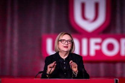 A women speaking at a podium