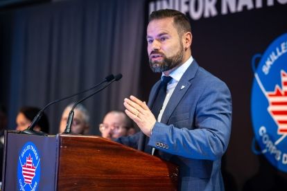 A man speaking at a podium