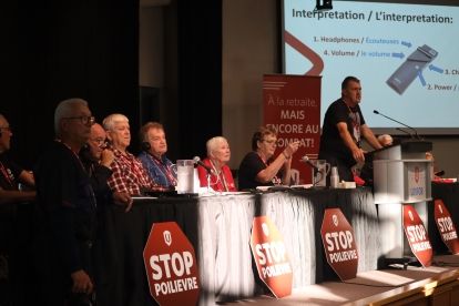 A man speaks at a podium