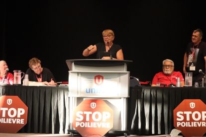 A women speaks at a podium