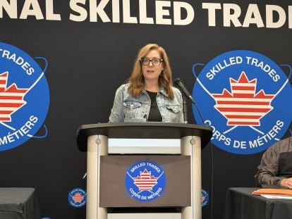 A women speaking at a podium