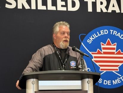 A man speaking at a podium