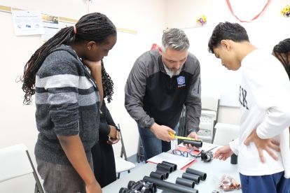 Paul teaching students on a hands on structure