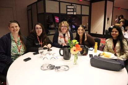 six people sitting at a table