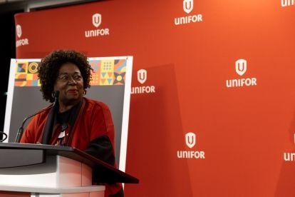 A women speaks at a podium