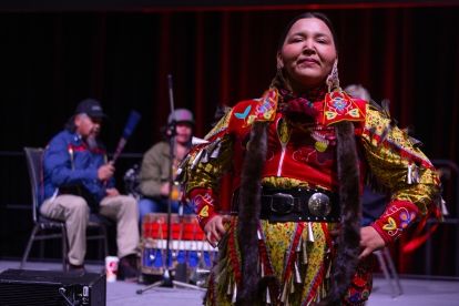 Amanda Fox performed an Indigenous dance while outfitted in a jingle dress – made of metal cones to represent tears – to symbolize healing.