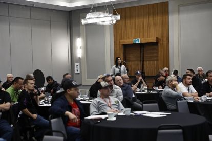 A women speaking into a mic