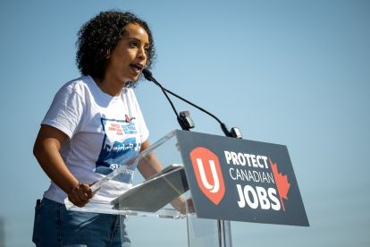 A women speaking at a podium
