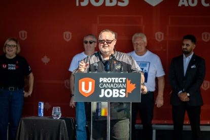 A man speaking at a podium