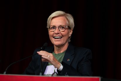 A women speaking at a podium
