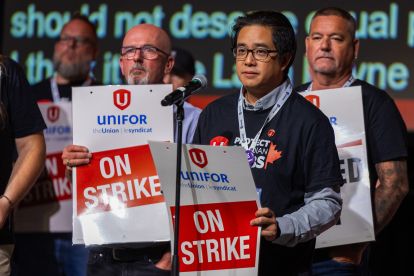A group holding "On Strike" signs