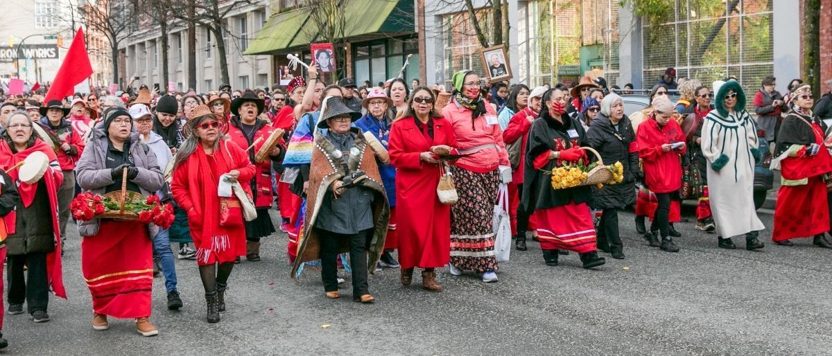 Group of people marching down the street