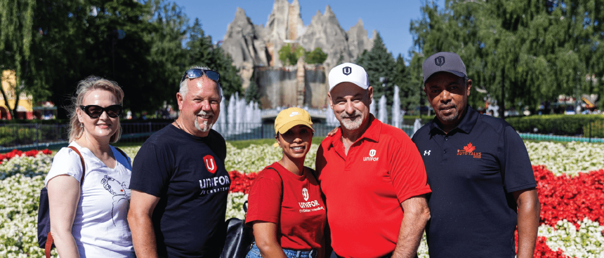 A group of people with Unifor swag in front of the Wonderland mountain