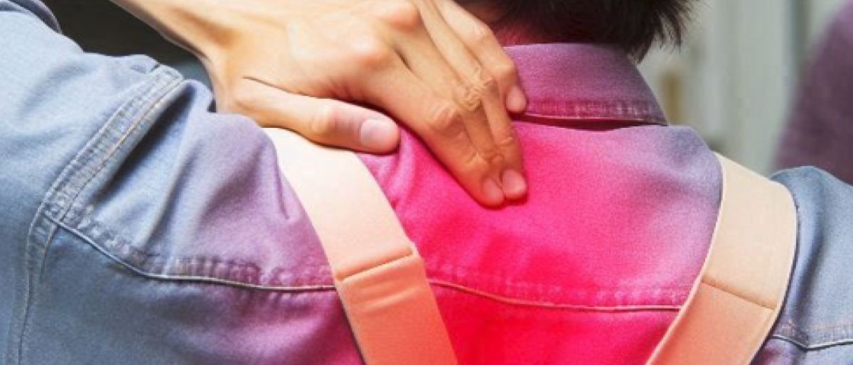 a man holding his neck, red spot marks soreness