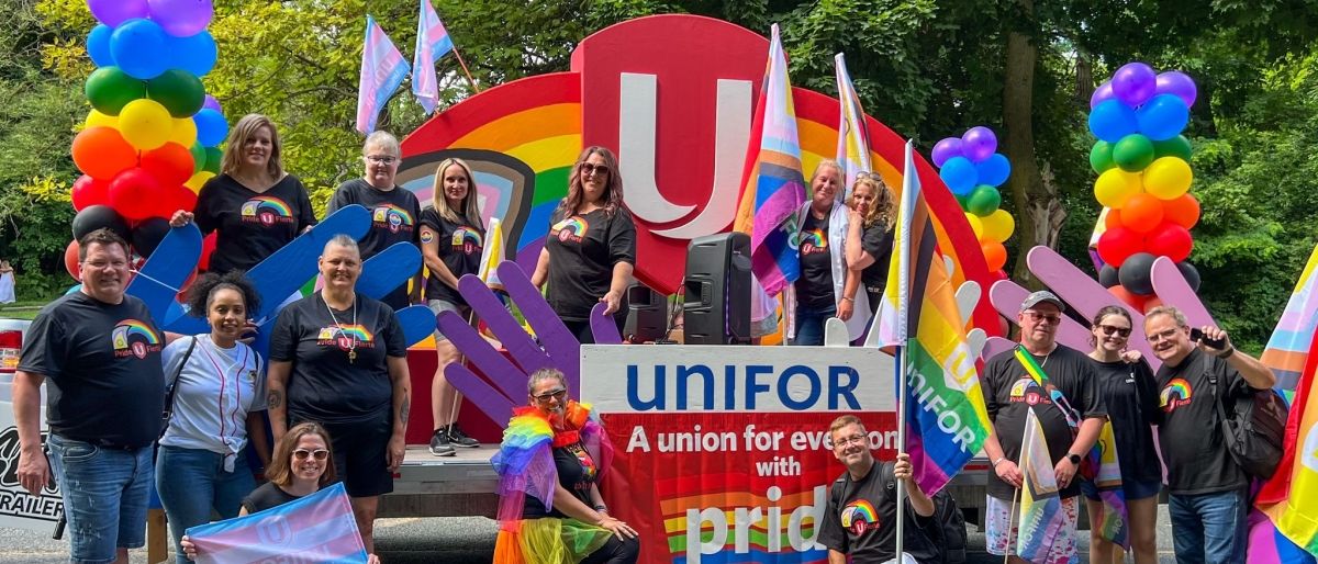 people posing at pride parade