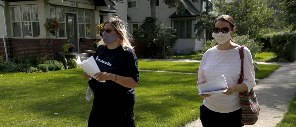 Two Unifor sisters doing election canvasing.