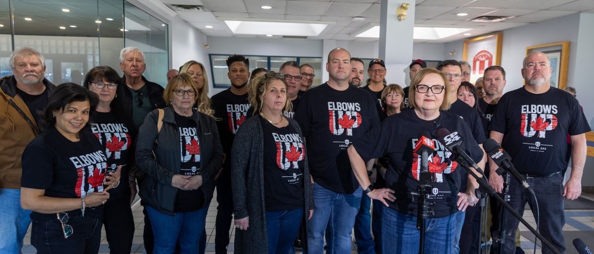 A group wearing elbows up shirts